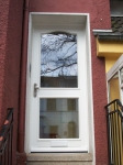 Haustür mit Friesbogen und Briefdurchwurf im unteren Flügelholz